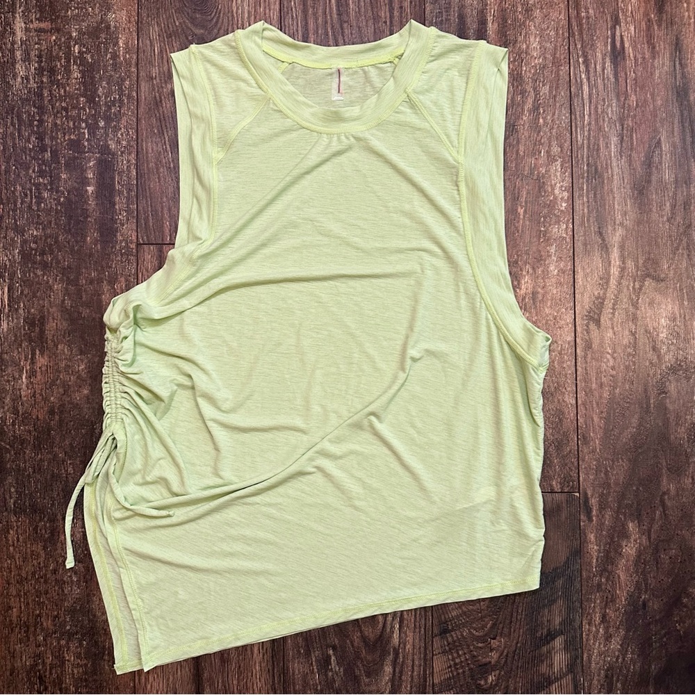 Free People Movement green asymmetrical sleeveless top size medium NWOT